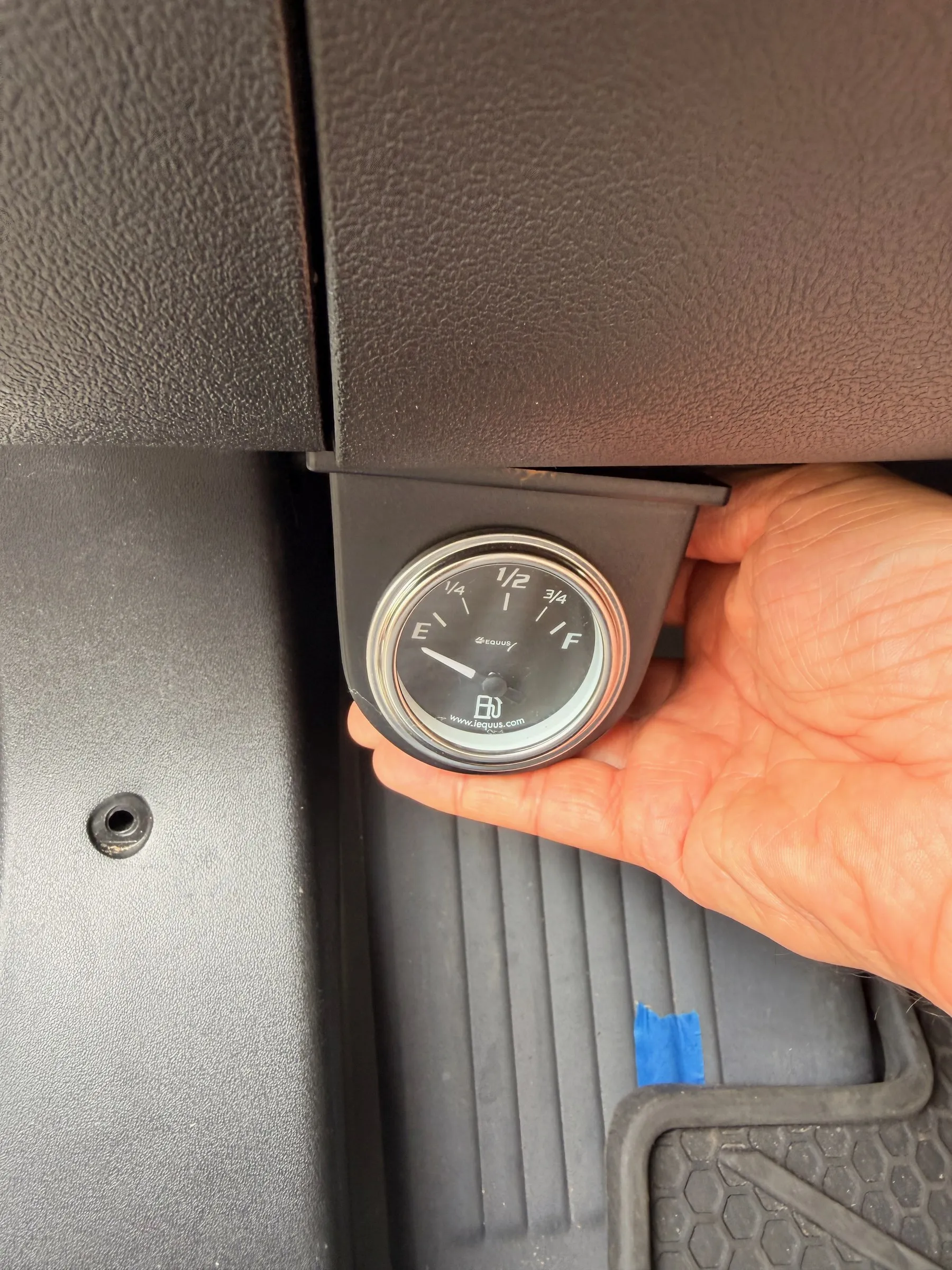 Round fuel gauge for the diesel heater tank mounted below the dash by the footwell
